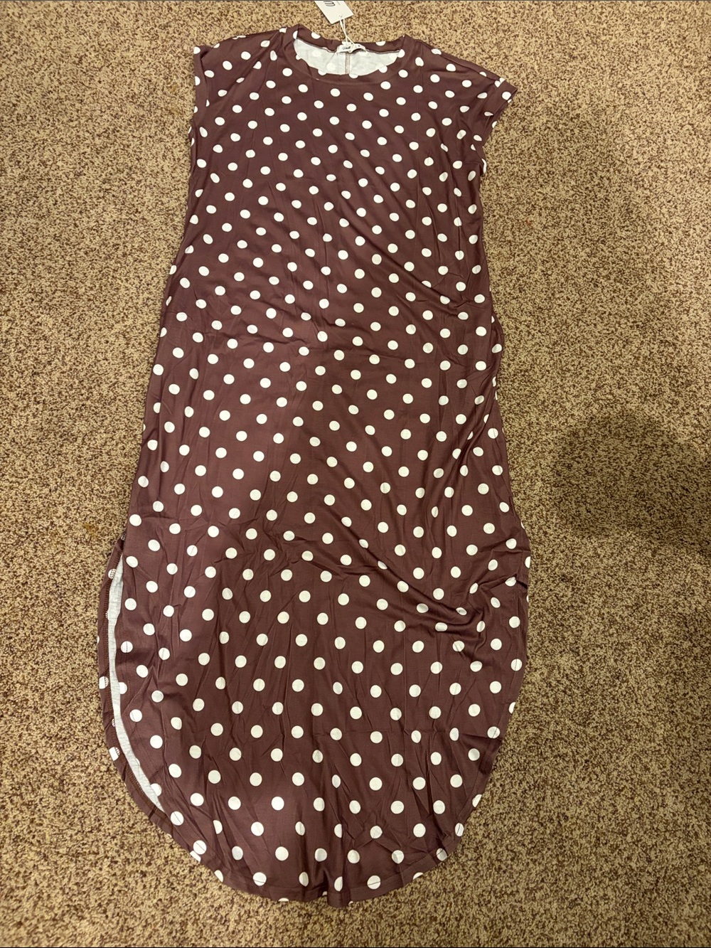 Brown polka dot cap sleeve lightweight dress with side slits and pockets.